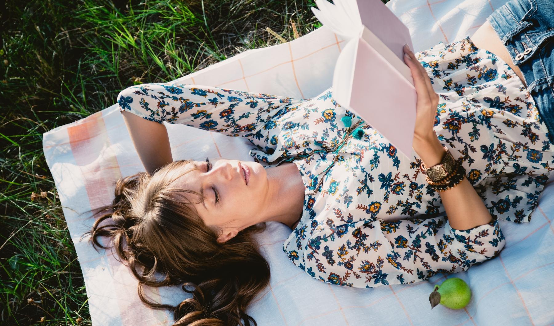 a person lying on a blanket