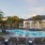 a pool with chairs around it