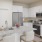 a kitchen with white cabinets