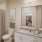 a bathroom with a sink toilet and mirror