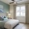 a bedroom with a large window